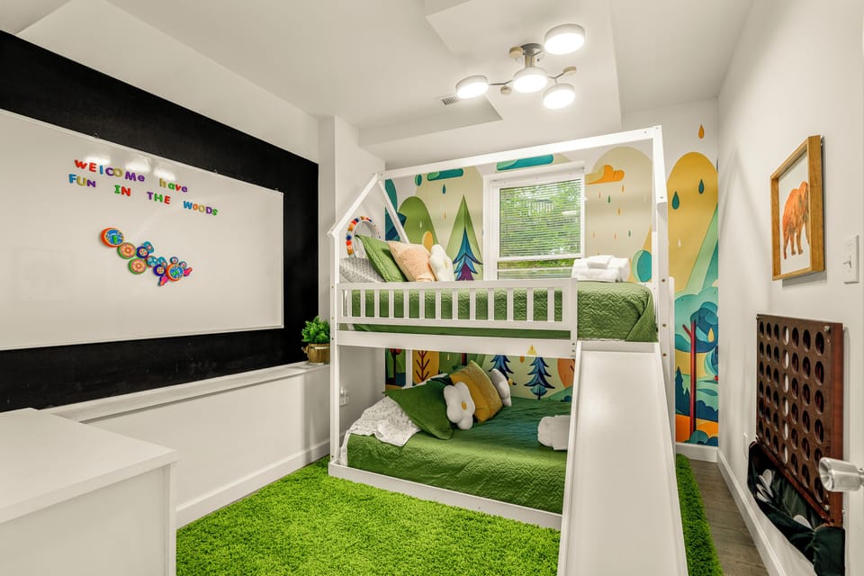 Kid's adventure bunk bed room with classic NES, magnetic wall and Connect Four