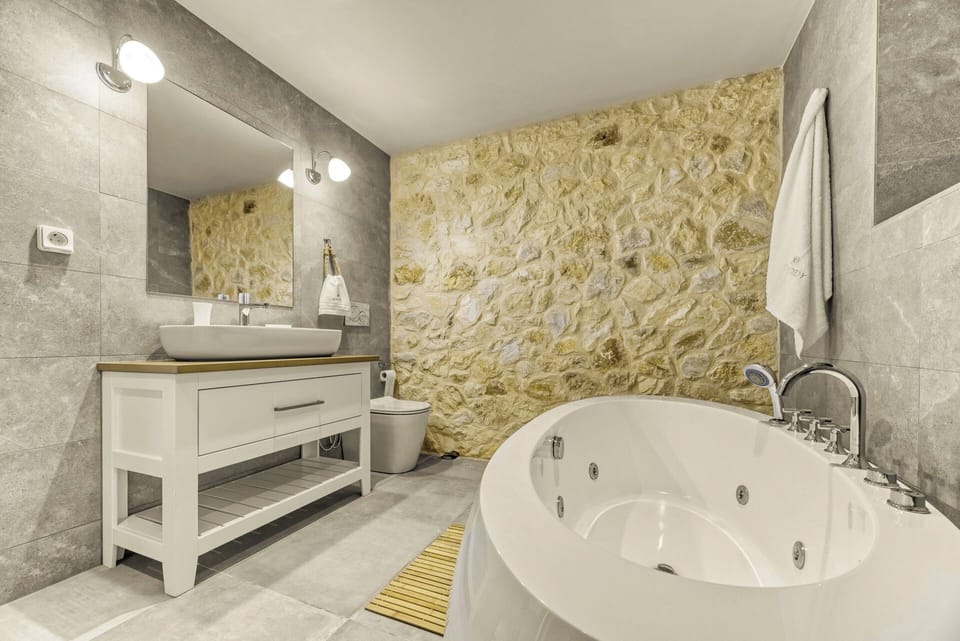 Superior House | Bathroom | Hair dryer, slippers, bidet, towels