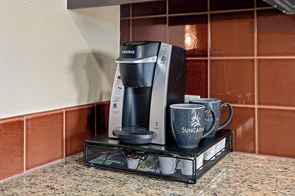 Coffee service features Lavazza Italian Pods, Tazo Tea, cream and sweeteners.