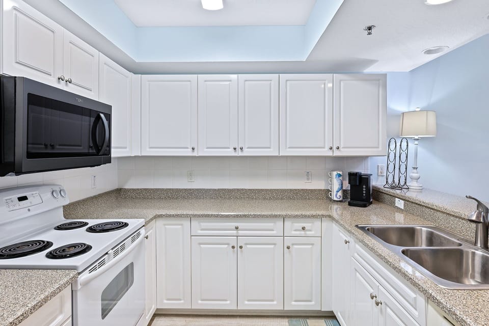 Equipped with everything you may need.  Keurig coffee pot featured in this photo.