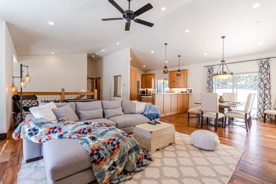 HUGE Living room with gas fireplace, board games and Fire TV/Roku TV! In the back there is a massage chair and electronic keyboard.