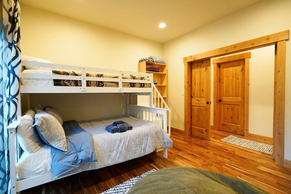 Bunk beds with full size on bottom and Twin on top, leading directly to the backyard.