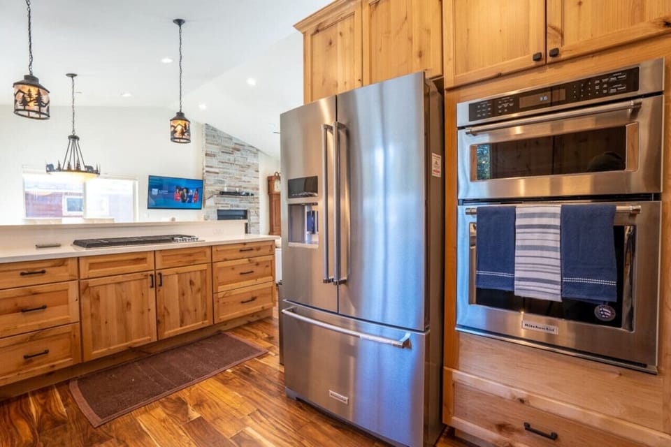 Modern equipped kitchen with 3 different coffee makers, dishwasher, stainless steel sink and more.