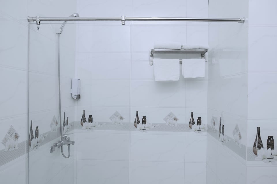 Separate tub and shower, free toiletries, hair dryer, slippers