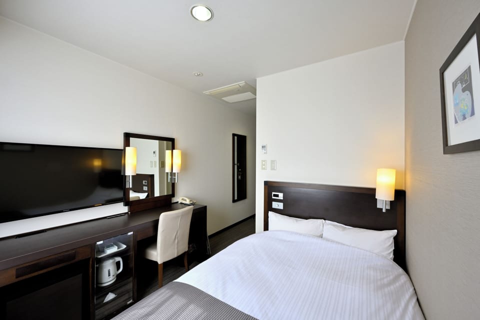 Down comforters, desk, WiFi (free), bed sheets