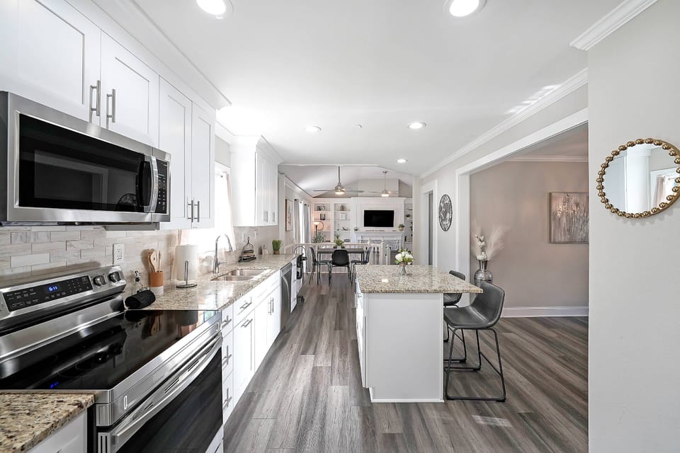 Kitchen leads to the second living room space.
