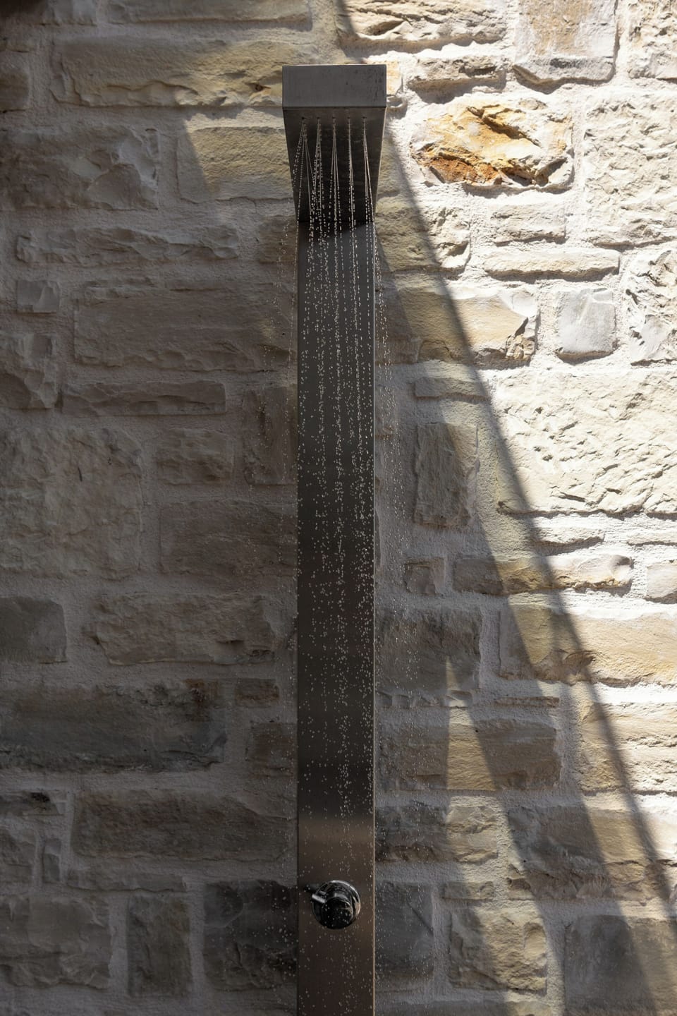 An outdoor shower is also available.