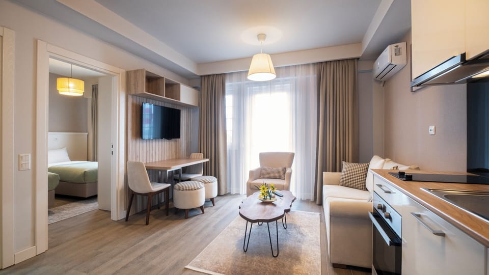 Deluxe Apartment, 1 Bedroom, Garden View | Hypo-allergenic bedding, in-room safe, desk, laptop workspace