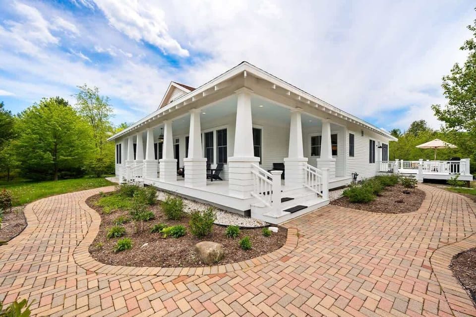 Enjoy stunning views of the secluded property on the wrap-around porch and large back patio, overlooking private walking trails perfect for the whole family to enjoy.