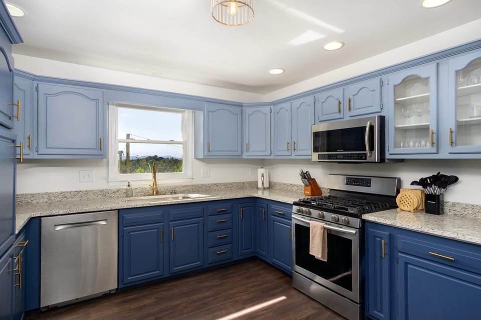 Fully equipped kitchen with blue accent!