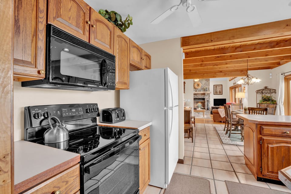 Prepare meals with ease in the well-equipped, inviting kitchen.
