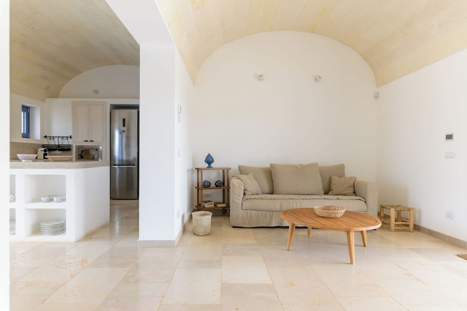 Deluxe Villa, Pool View | Living room | 35-inch flat-screen TV with digital channels