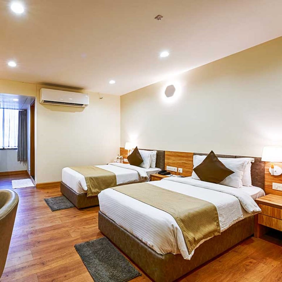 Deluxe Twin Room, City View | In-room safe, desk, iron/ironing board (on request), WiFi (free)