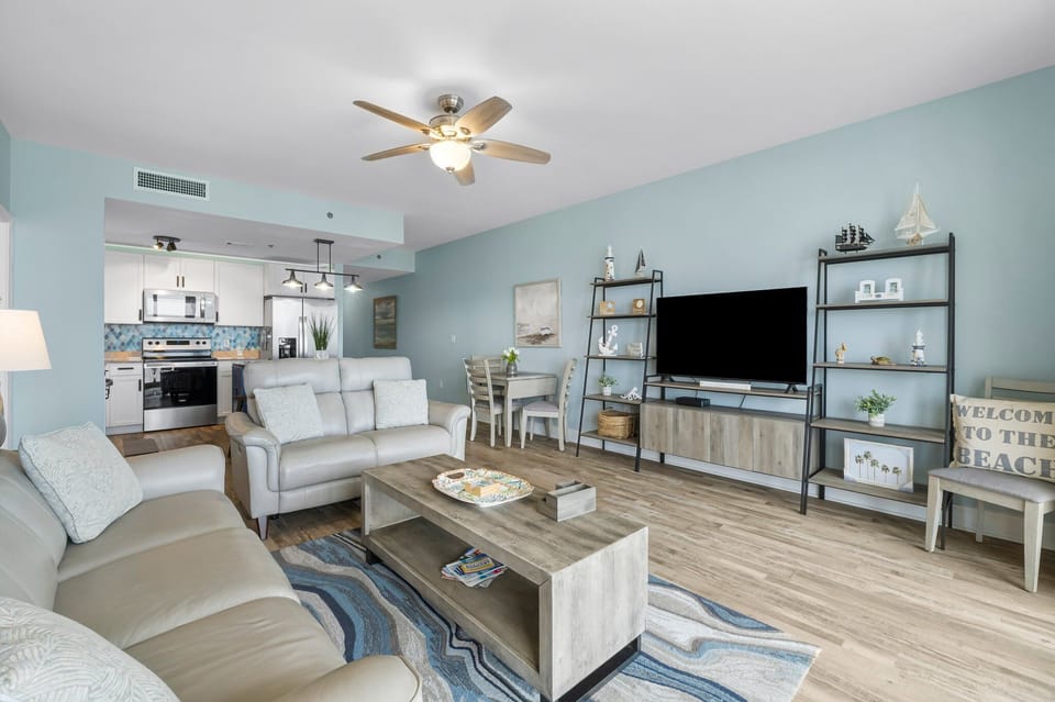 Open-concept living area with modern furnishings and a fully equipped kitchen.