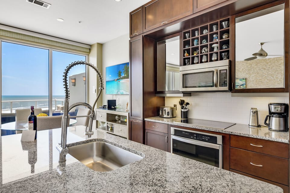 Fully-equipped kitchen with refrigerator, microwave, Keurig, coffee pot, dishwasher, garbage disposal.  Indoor dining!
