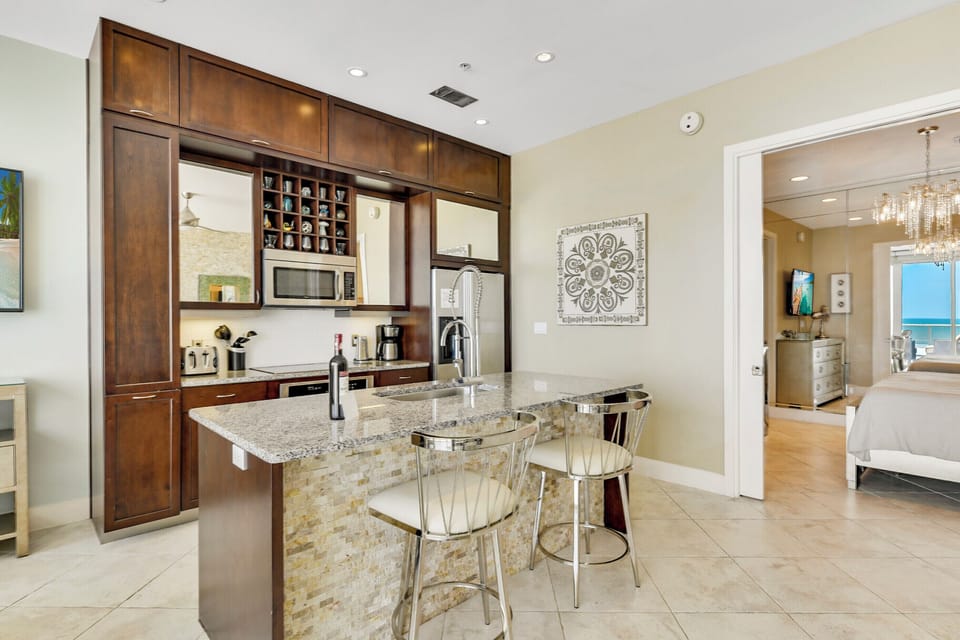 Fully-equipped kitchen with refrigerator, microwave, Keurig, coffee pot, dishwasher, garbage disposal.  Indoor dining!