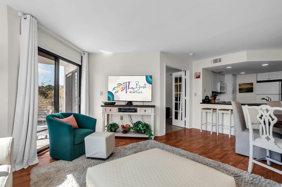 Step into your bright open living space where modern comfort meets coastal charm, with stylish furnishings and natural light streaming through.