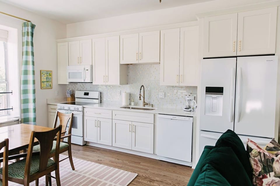 Large kitchen with custom cabinetry and full sized appliances. 