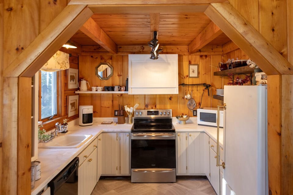 The recently refreshed kitchen has a microwave, coffee maker, ice cream maker, dishwasher, and all new pots, pans, and silverware.