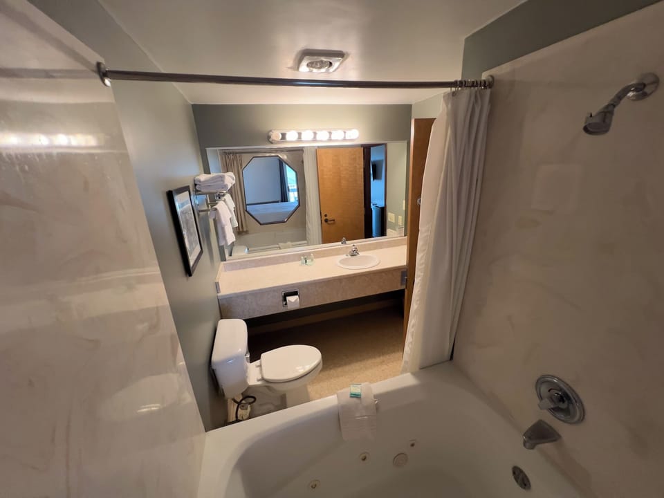 Classic Room, 1 King Bed, Lake View | Bathroom | Combined shower/tub, hair dryer, towels, soap