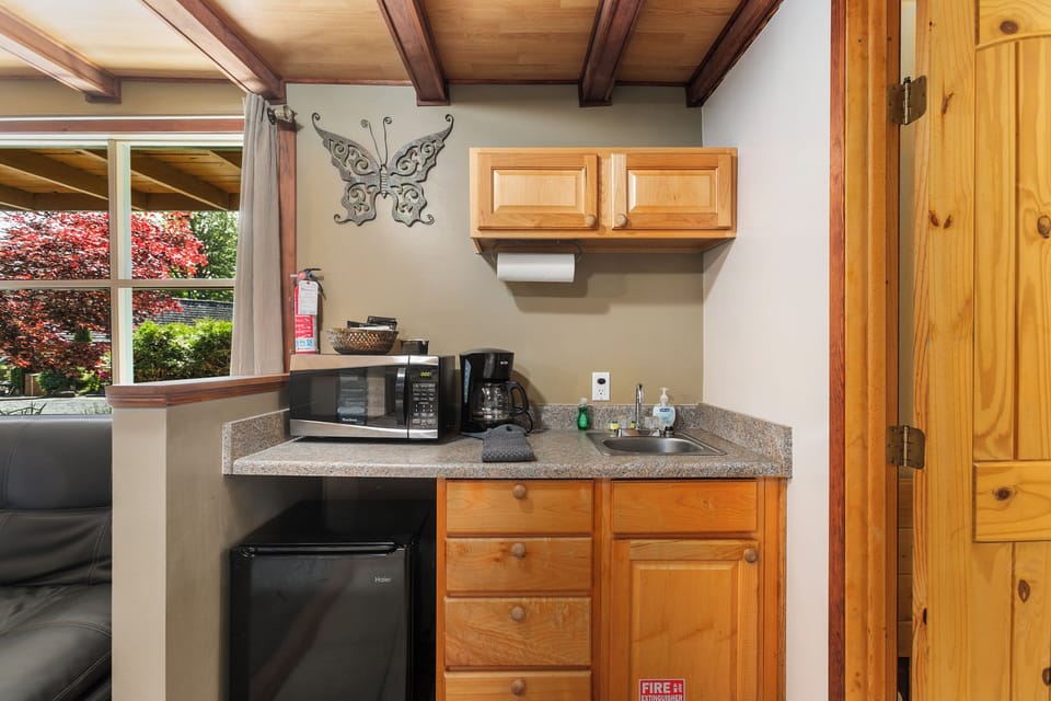 Mini-fridge, microwave, coffee/tea maker, cookware/dishes/utensils