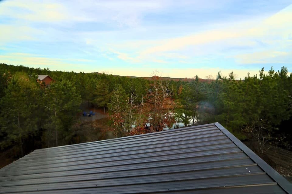 Pond View from Top Bunks of our serene cabin nestled amidst a snowy forest.