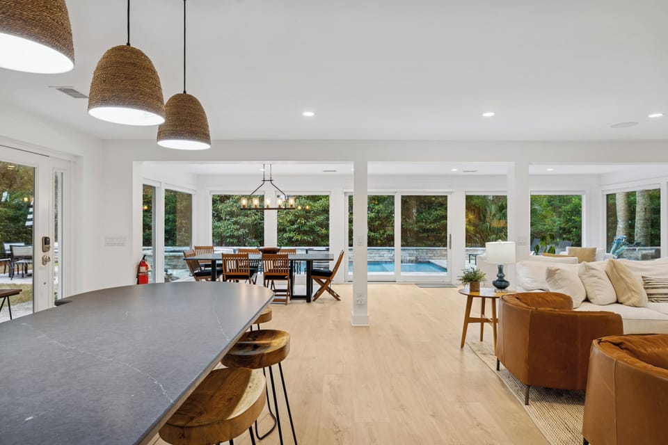 Adjoining dining and living areas provide a perfect backdrop for entertaining or simply relaxing