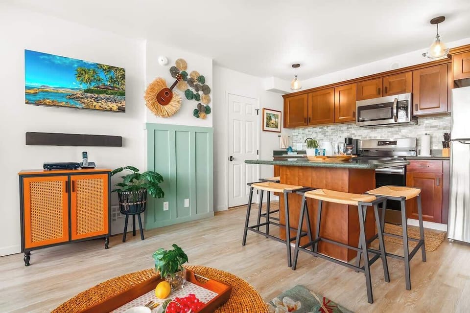 Dining area with 4 chairs and 40" Smart TV in the living room