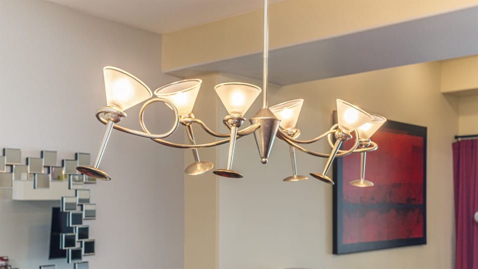 Martini glass light fixture in the dining area