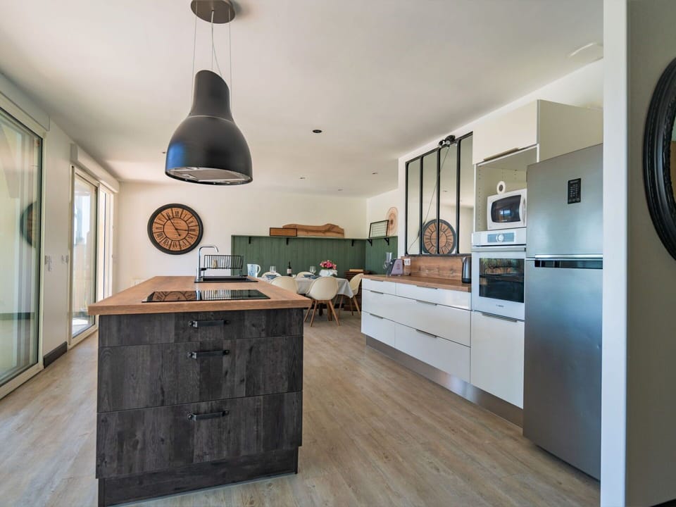 Cabinetry, Countertop, Kitchen, Drawer, Lighting, Wood, Interior Design, Flooring, Floor, Building