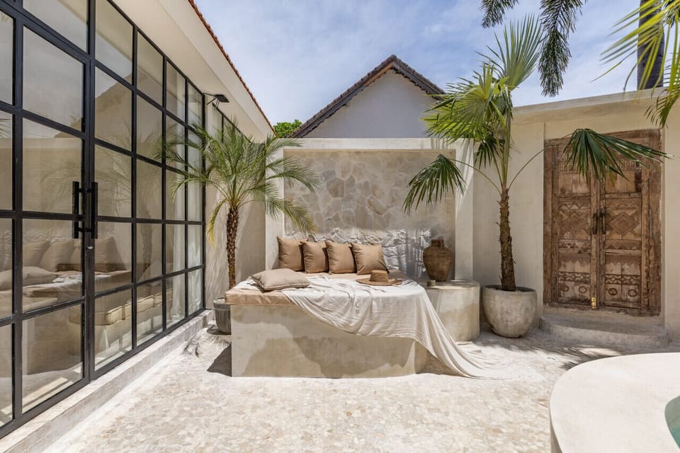 A chic and cozy corner in our villa, where comfort meets elegance under the shade of palms.