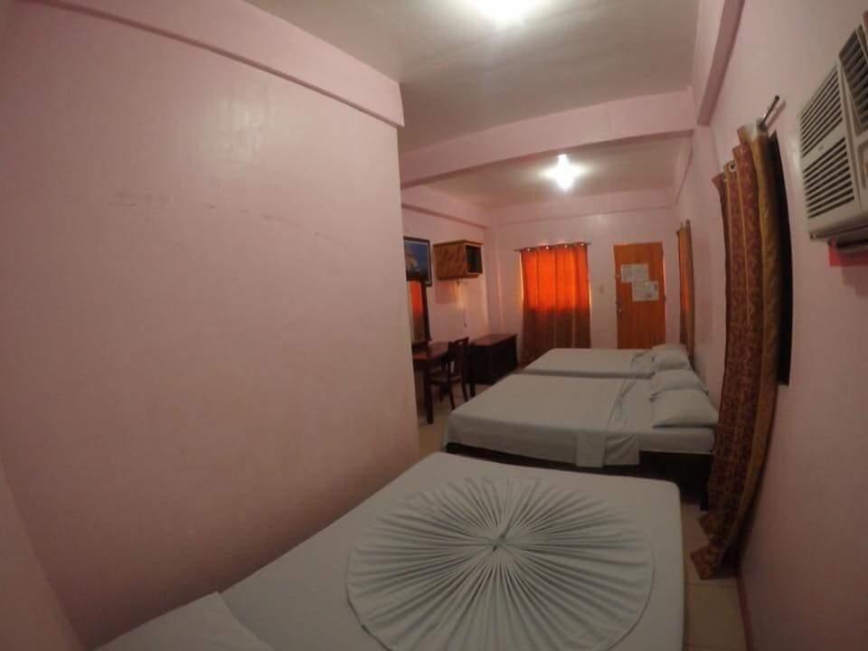 Economy Room, Multiple Beds, Balcony, Partial Sea View | Premium bedding, individually decorated, individually furnished, desk
