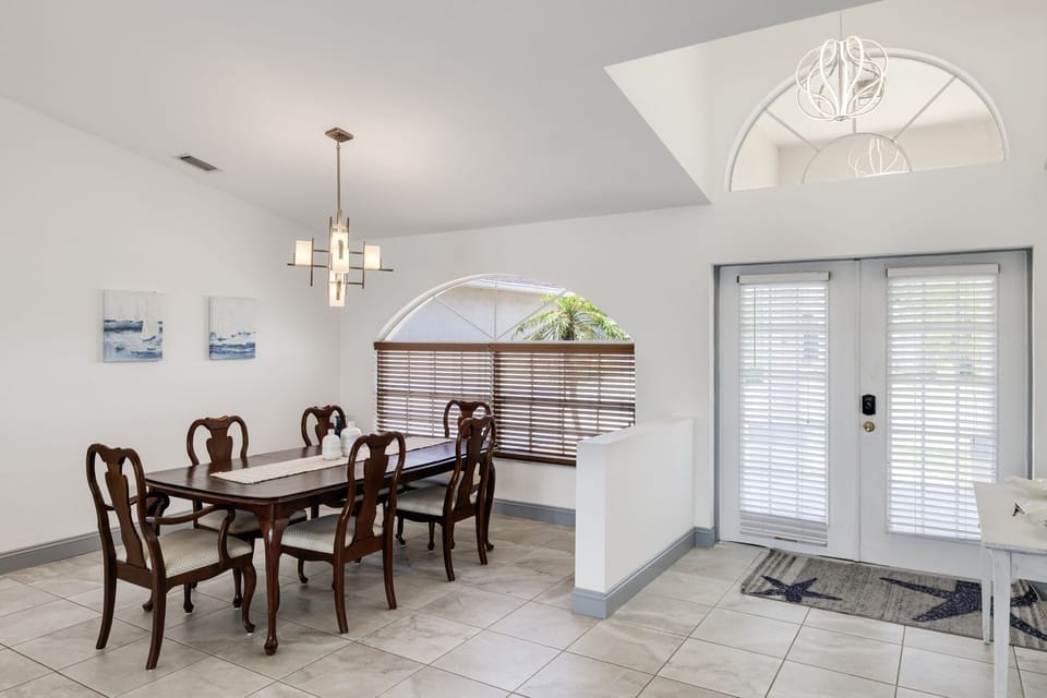 Formal dining table at front of home capable of seating six guests