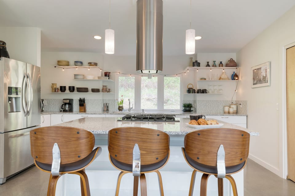 Kitchen barstool seating ensures everyone can gather comfortably.