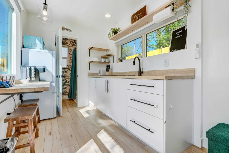Bright and airy! The fully-equipped kitchenette has everything you need for easy meal prep, while the Roku Smart TV ensures entertainment at your fingertips.