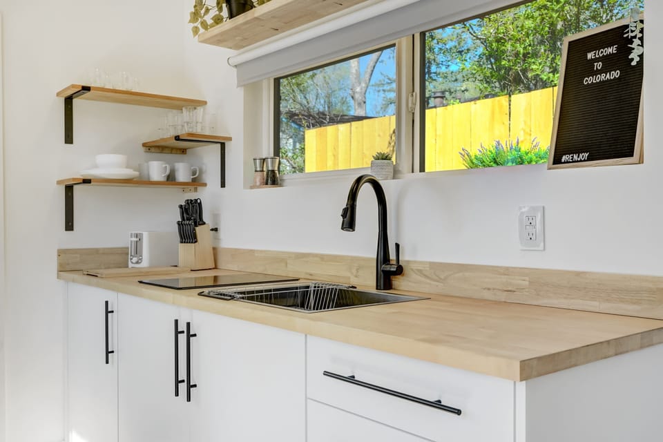Enjoy a peaceful view of your private patio from the kitchen – a perfect spot to start your day with a cup of coffee and the morning sun.