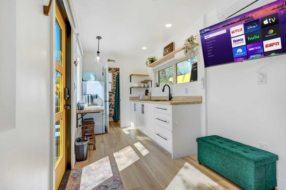 Bright and airy! The fully-equipped kitchenette has everything you need for easy meal prep, while the Roku Smart TV ensures entertainment at your fingertips.