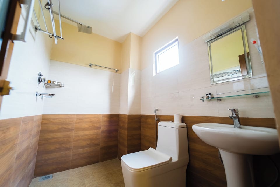 Room, Garden View | Bathroom | Shower, slippers, towels, soap