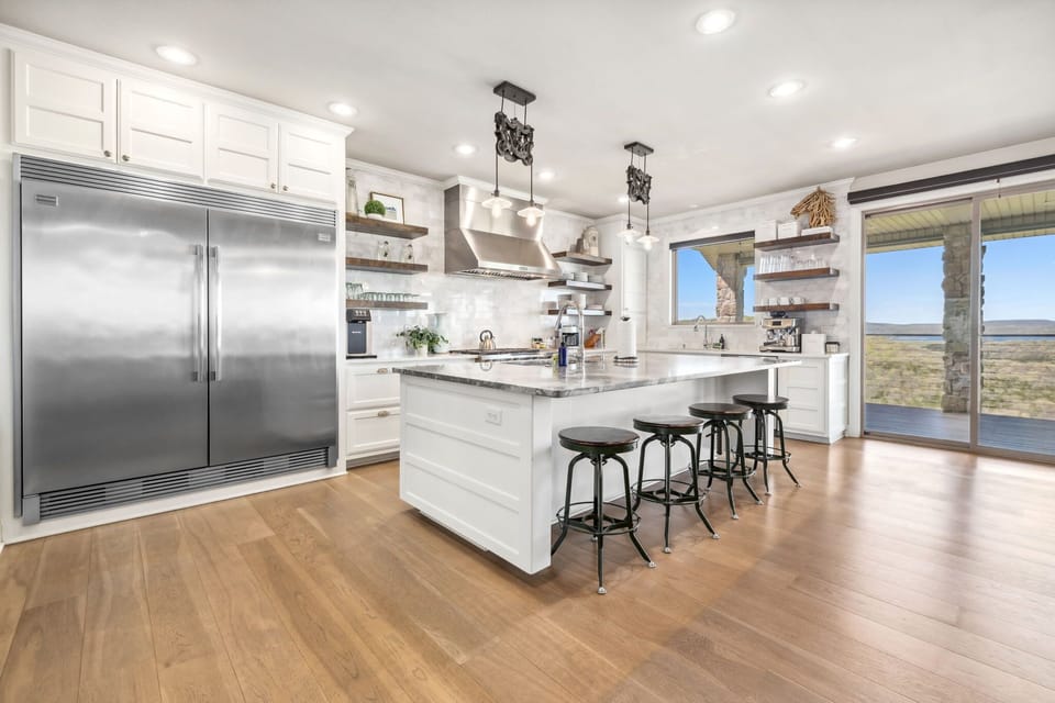 Our top-of-the-line kitchen is fully stocked and features a huge island with extra seating.