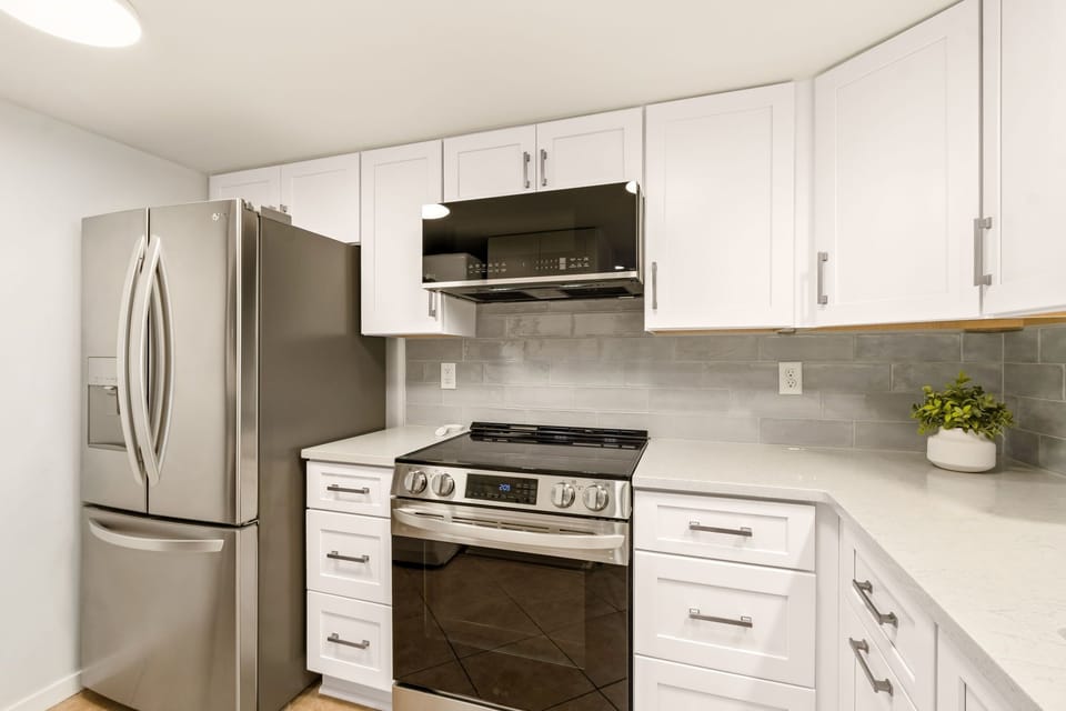Fully Stocked Kitchen Opens to Living and Dining Area