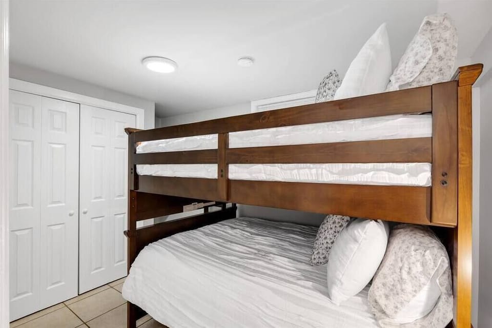 Bedroom #5. Downstairs with a set of full size bunk beds. 2 people per bed. 4 total