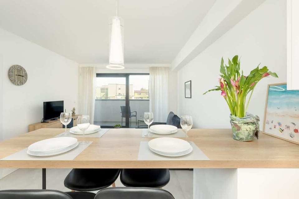 Living room with dining table and chairs.