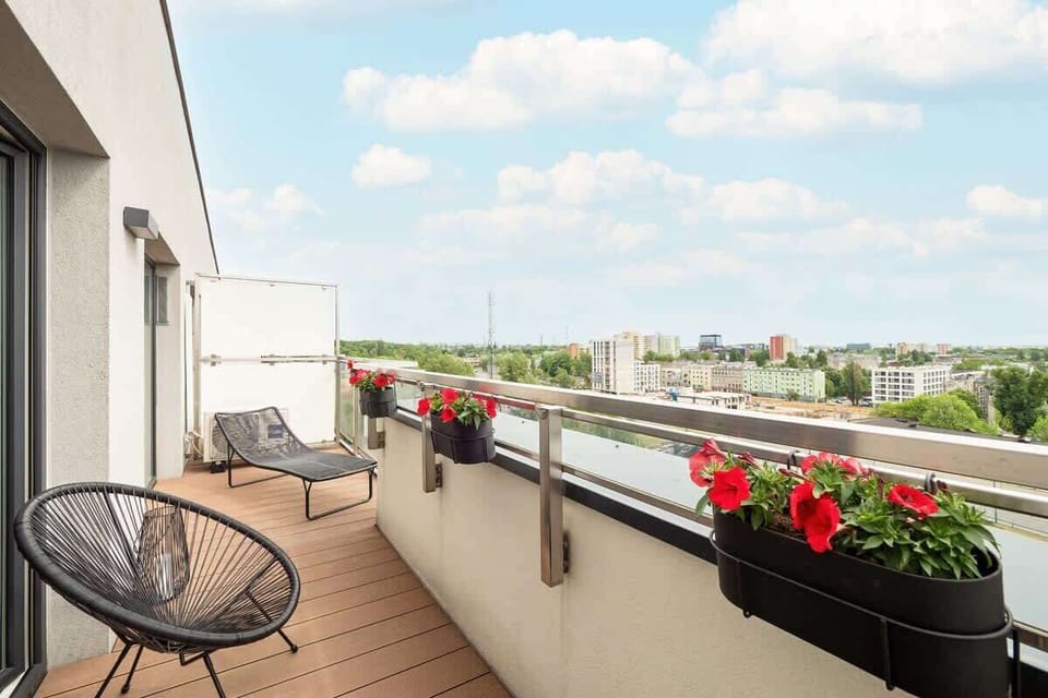 The city view from the balcony on a sunny day reveals the panorama of Łódź in all its glory.