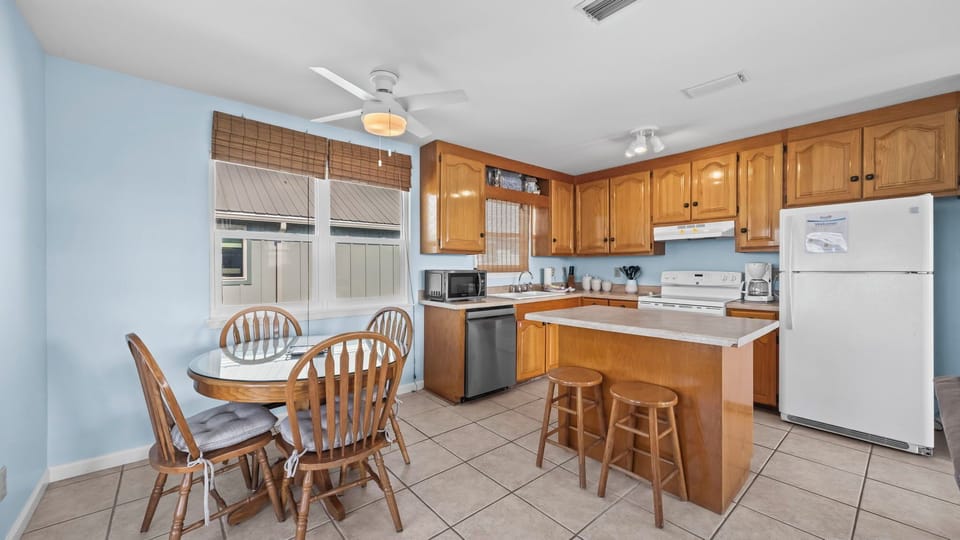 Second Choice - - Dining area paired with a fully equipped kitchen for convenient meal prep