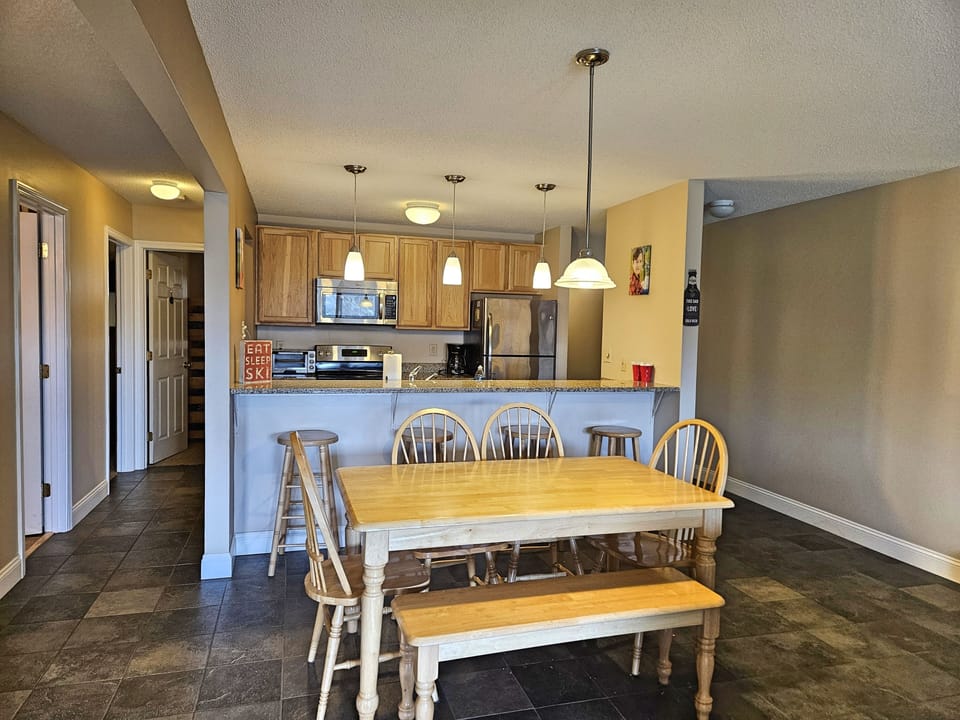 Dining area and kitchen, bedrooms to left