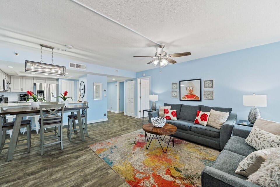 Open living area w/ comfy seating, bright accents, and an easy flow for relaxing together.