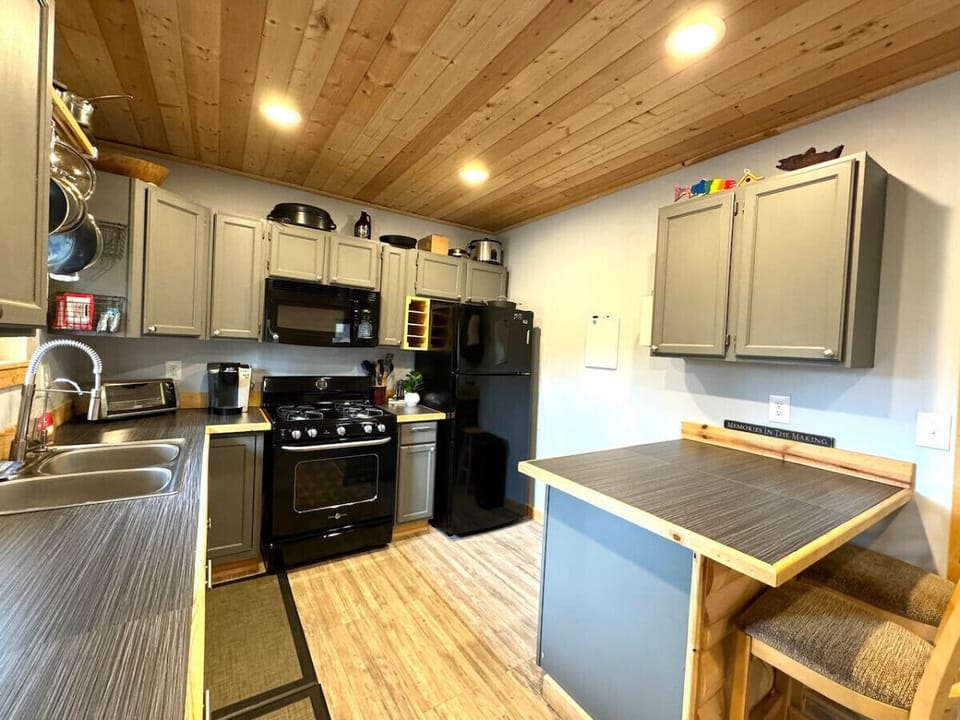 Kitchen area with barstool seating.