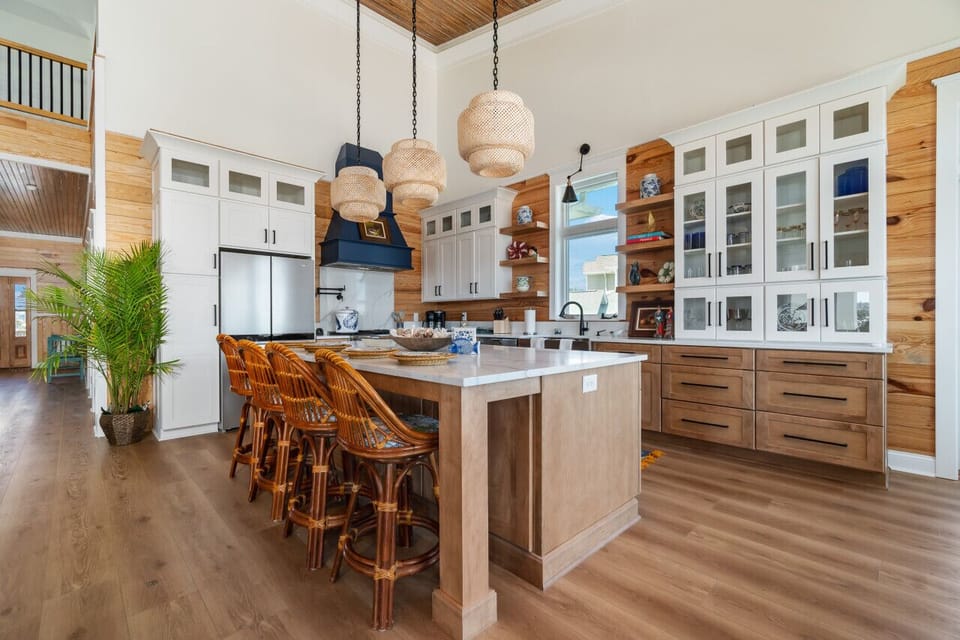 Gourmet kitchen with top of the line appliances and well stocked cabinets