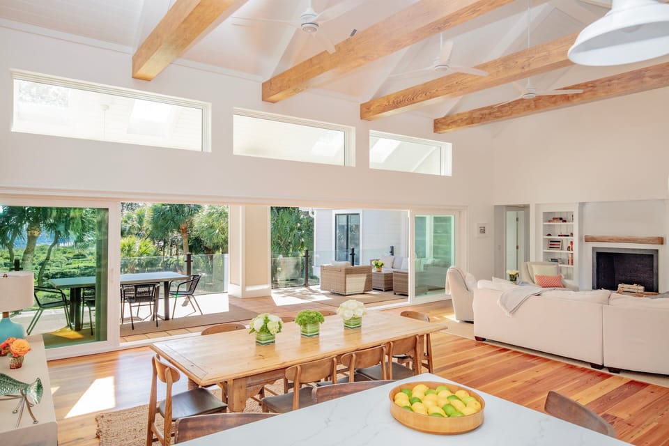 Floor-to-ceiling glass windows frame stunning ocean vistas, transforming this space into a Californian-style retreat.