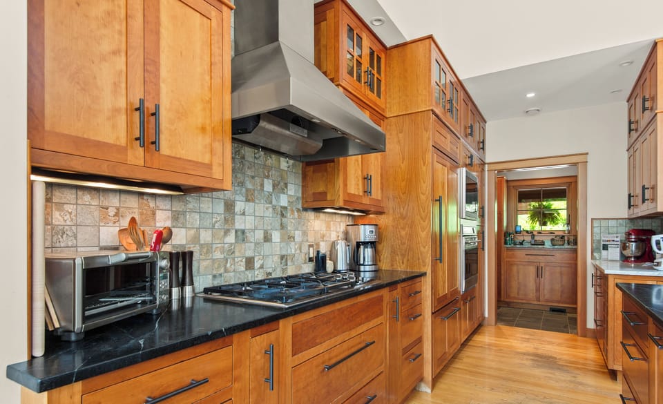 Five Star Kitchen with custom cabinets, dishwasher, microwave, coffee maker, crock pot, baking nook, mixer, sous vide, blender, toaster oven